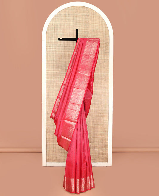 Red Vasundhara Silk Saree, Subtly Sparkled with Zari Checks All Over Its Body, Highlighted by Zari Border of Thilakam Mokku, Kamalam, Mayil Kann, Rudraksham, and Kuthirai Designs, Pallu of Jaal Designs, and Paired with a Matching Blouse