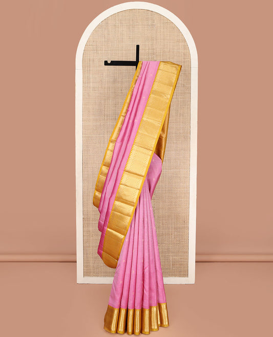 Pink Vasundhara Silk Saree, Subtly Sparkled with Zari Buttas and Checks All Over Its Body, Complemented by a Contrast Border of Rekku, Rudraksham, and Then Kuli Kann Designs, Grand Jaal Pallu, and Paired with a Contrast Blouse