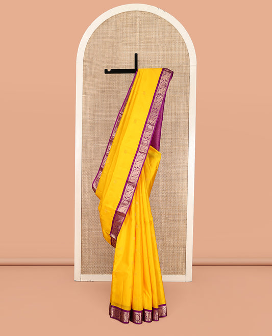 Yellow Vasundhara Silk Saree, Subtly Sparkled with Zari Buttas, Complemented by Contrast Border of Rekku, Chakram, and Yaanai Designs, Jaal Pallu, and a Contrast Blouse