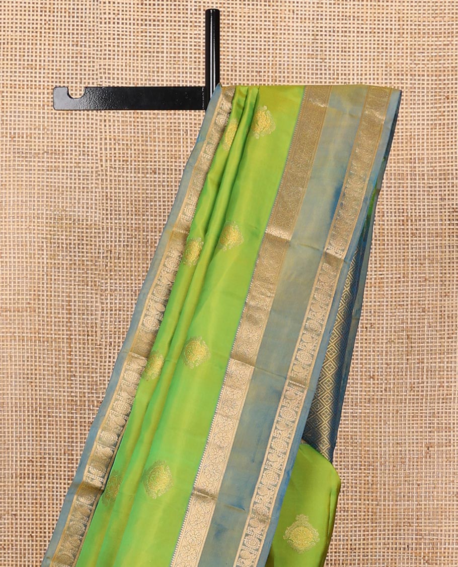 Green zari buttas silksaree, contrast rettai pettu border of rekku,kodi visiry & annam chakram & zari-rich jaal pallu