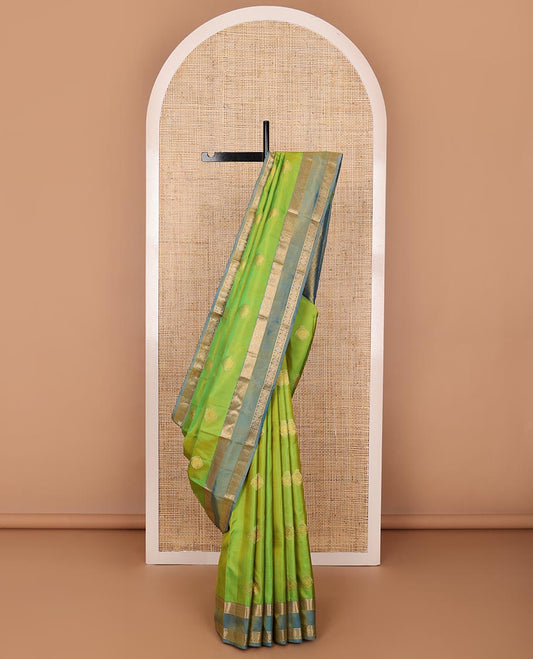 Green zari buttas silksaree, contrast rettai pettu border of rekku,kodi visiry & annam chakram & zari-rich jaal pallu