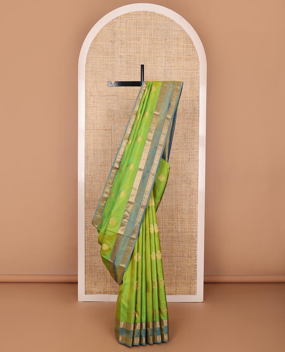 Green zari buttas silksaree, contrast rettai pettu border of rekku,kodi visiry & annam chakram & zari-rich jaal pallu