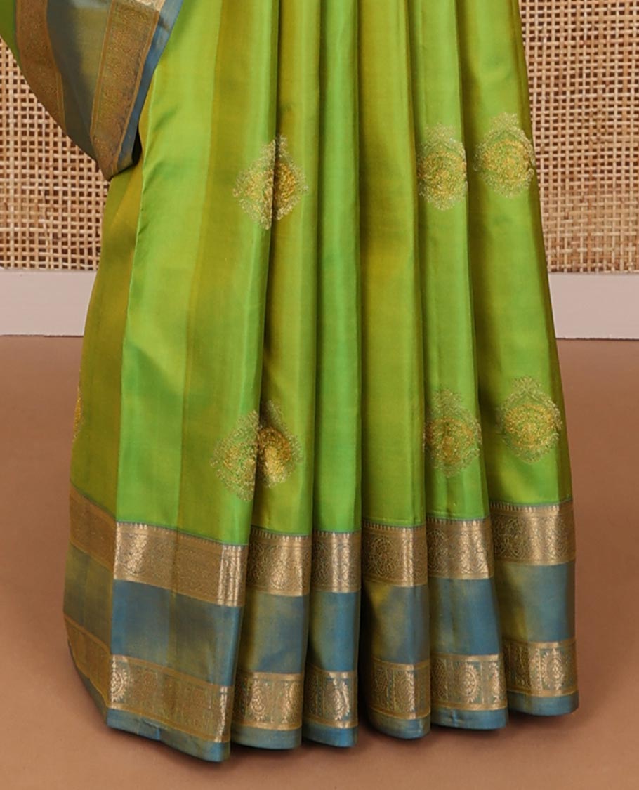 Green zari buttas silksaree, contrast rettai pettu border of rekku,kodi visiry & annam chakram & zari-rich jaal pallu
