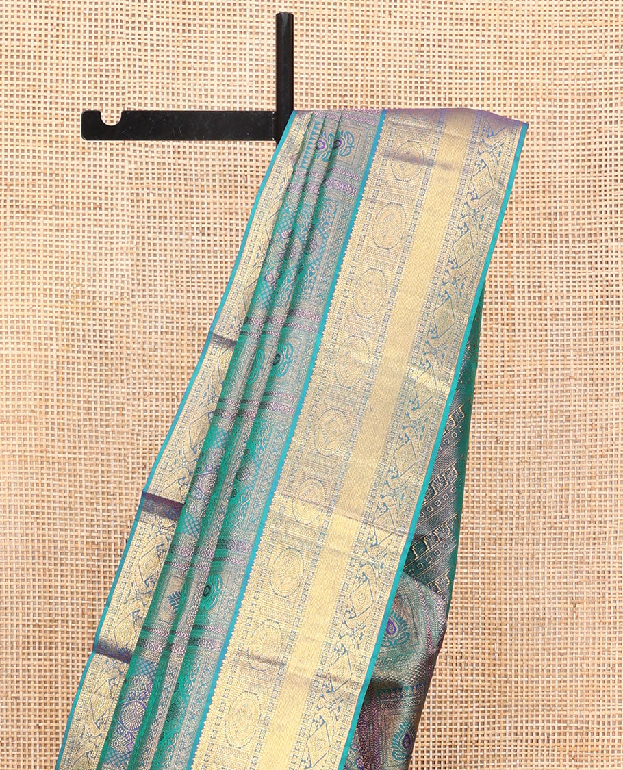 Blue Kanchipuram Wedding Silk Saree, Masterfully Woven with Jacquard Design on Its Body, Highlighted by a Zari Border of Thilakam, Chakram, Diamond, and Mayil Designs, Majestically Detailed Pallu, and Paired with a Matching Blouse