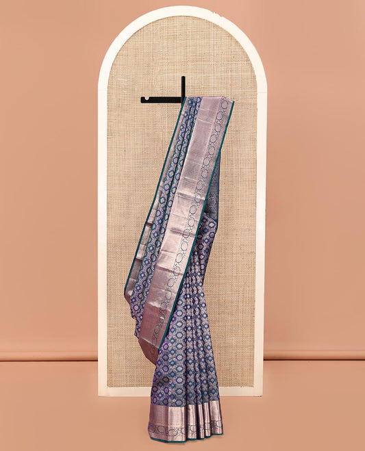 Blue Kanchipuram Wedding Silk Saree, Gleamed Up with Jacquard Designs on Its Body, Highlighted by a Zari Border of Rekku, Laddu Kamalam, Mayil Kann, and Kodi Visiry Designs, Grand Jaal Pallu, and Paired with a Matching Blouse
