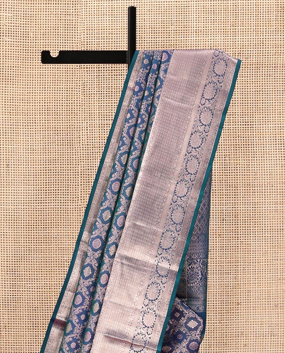Blue Kanchipuram Wedding Silk Saree, Gleamed Up with Jacquard Designs on Its Body, Highlighted by a Zari Border of Rekku, Laddu Kamalam, Mayil Kann, and Kodi Visiry Designs, Grand Jaal Pallu, and Paired with a Matching Blouse