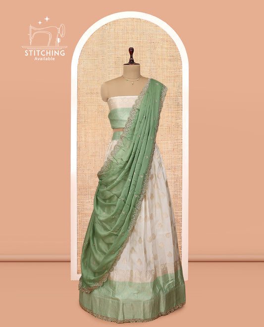 Cream-Green Banarasi Half-Saree, Bedecked with Buttas Skirt, a Contrast Traditional Lace Border, Matching Blouse, and Scallop Embroidered Dupatta