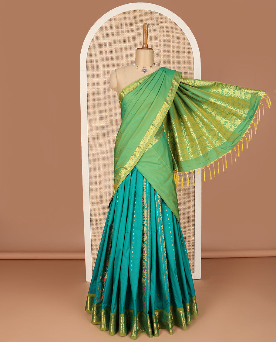 Green art silk half-saree pavadai material, zari design with contrast traditional bordered skirt, matching blouse, and zari design dhavani