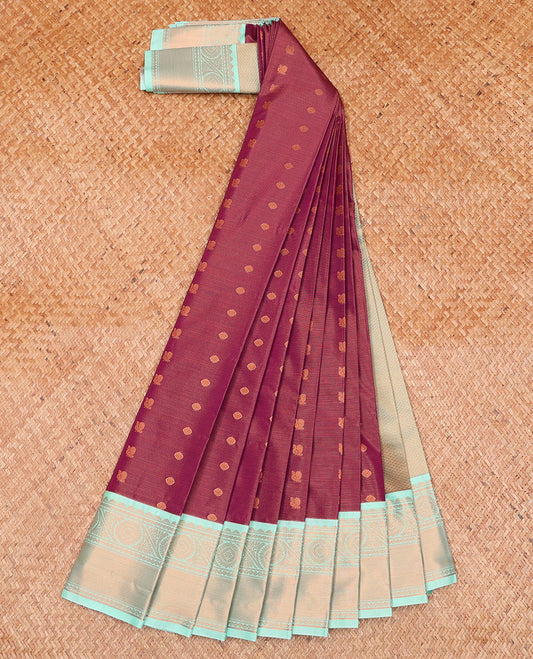 Burgundy Budget Silk Saree, Mesmerized with Peacock and Chakram Buttas on Its Body, Complemented by a Contrast Traditional Zari Border, Gleaming Jaal Pallu, and Paired with a Contrast Blouse