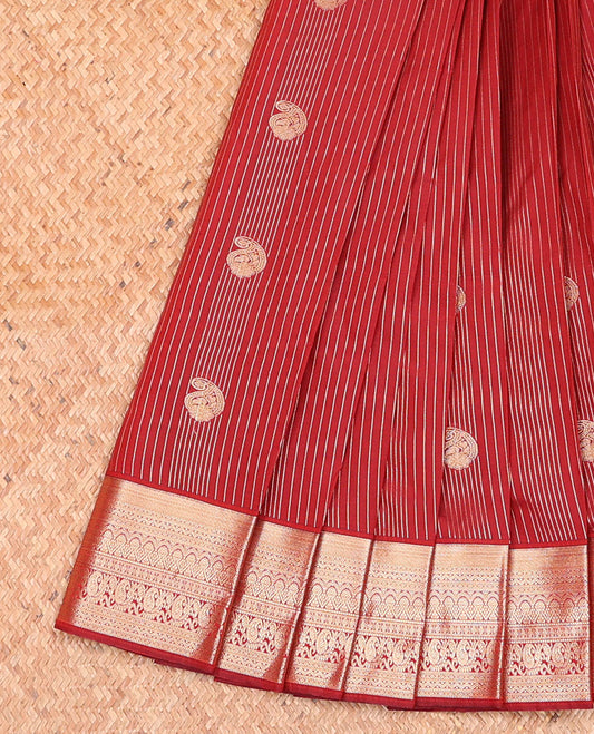Crimson Red Budget Silk Saree Showcasing Zari Stripes and Paisley Buttas, Accentuated by a Traditional Motif Zari Border, Adorned with a Jaal-Designed Pallu, and Paired with a Matching Blouse