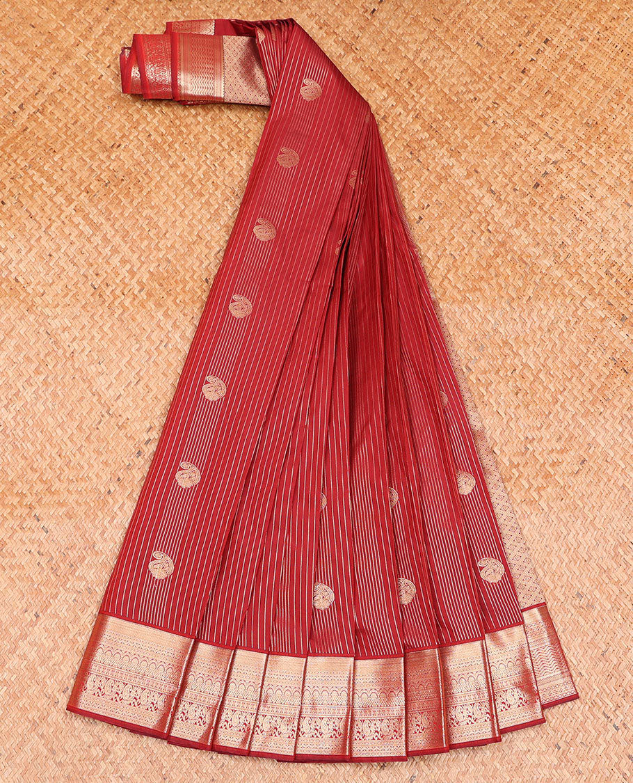 Crimson Red Budget Silk Saree Showcasing Zari Stripes and Paisley Buttas, Accentuated by a Traditional Motif Zari Border, Adorned with a Jaal-Designed Pallu, and Paired with a Matching Blouse