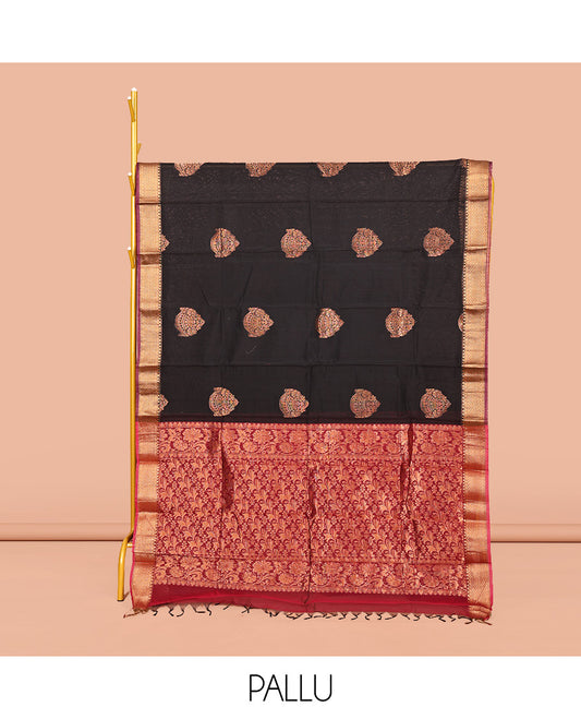 Black Semi-Silk Cotton Saree, Gleamed Up with Buttas on Its Body, Complemented by a Contrast Traditional Motifs Zari Woven Border, Intricately Designed Pallu, and Paired with a Contrast Blouse