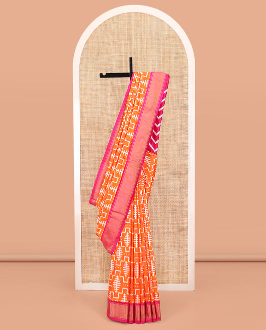 Orange Ikkat Silk Saree, Mesmerized with Ikkat-Style Geometric Patterns on Its Body, Complemented by a Contrast Border, Pallu Features Chevron Stripes, and Paired with a Contrast Blouse