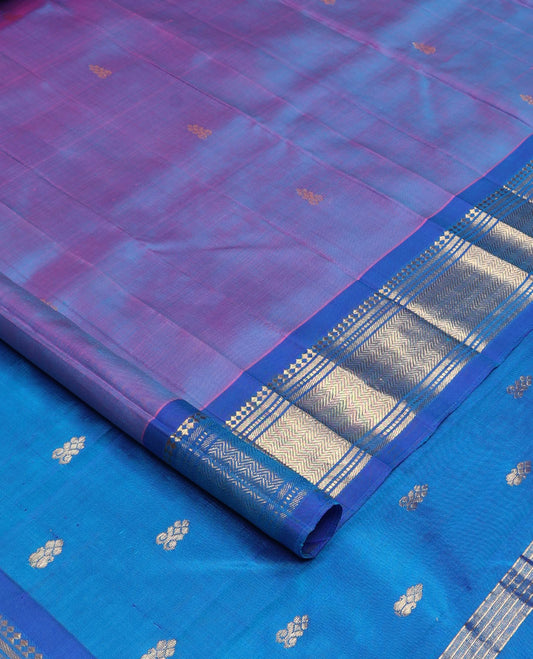 Violet zari buttas Kanchipuram silk saree, contrast one-sided border of paneer sombu, banaras, muthu, and vanki designs, and zari design pallu