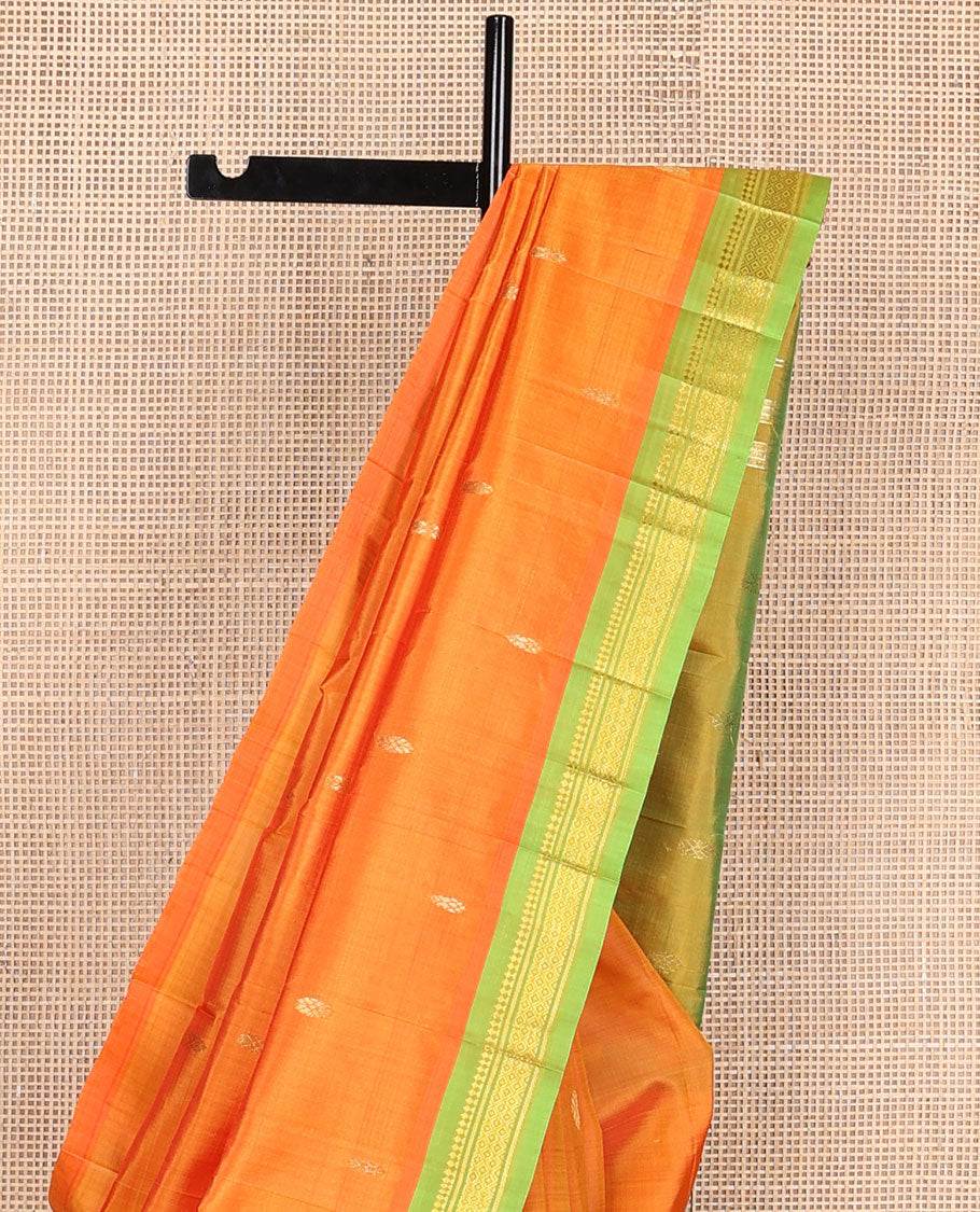 Kesari orange zari buttas kanchipuram silksaree, contrast one-sided border of paneer sombu,banaras & mayil kann & zari design pallu