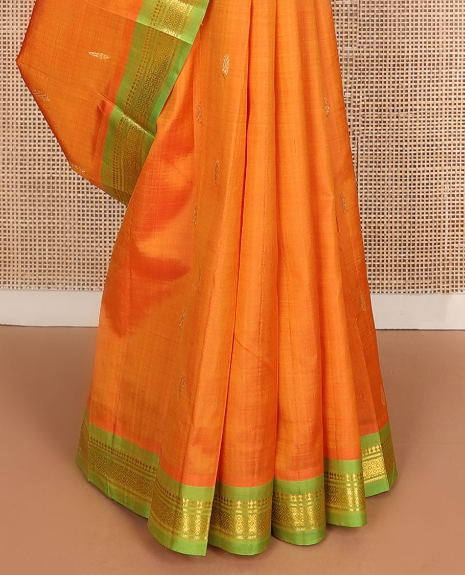 Kesari orange zari buttas kanchipuram silksaree, contrast one-sided border of paneer sombu,banaras & mayil kann & zari design pallu