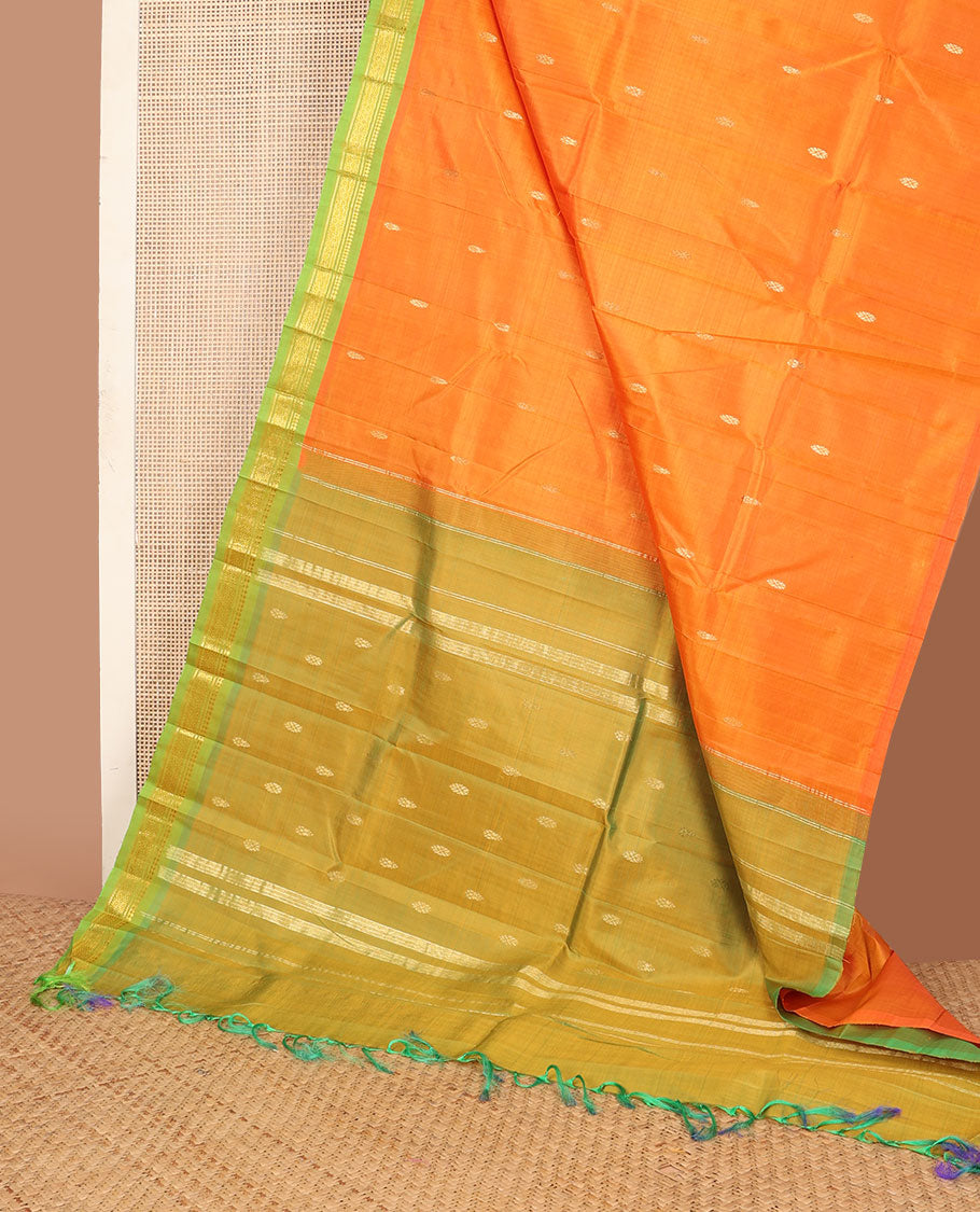 Kesari orange zari buttas kanchipuram silksaree, contrast one-sided border of paneer sombu,banaras & mayil kann & zari design pallu