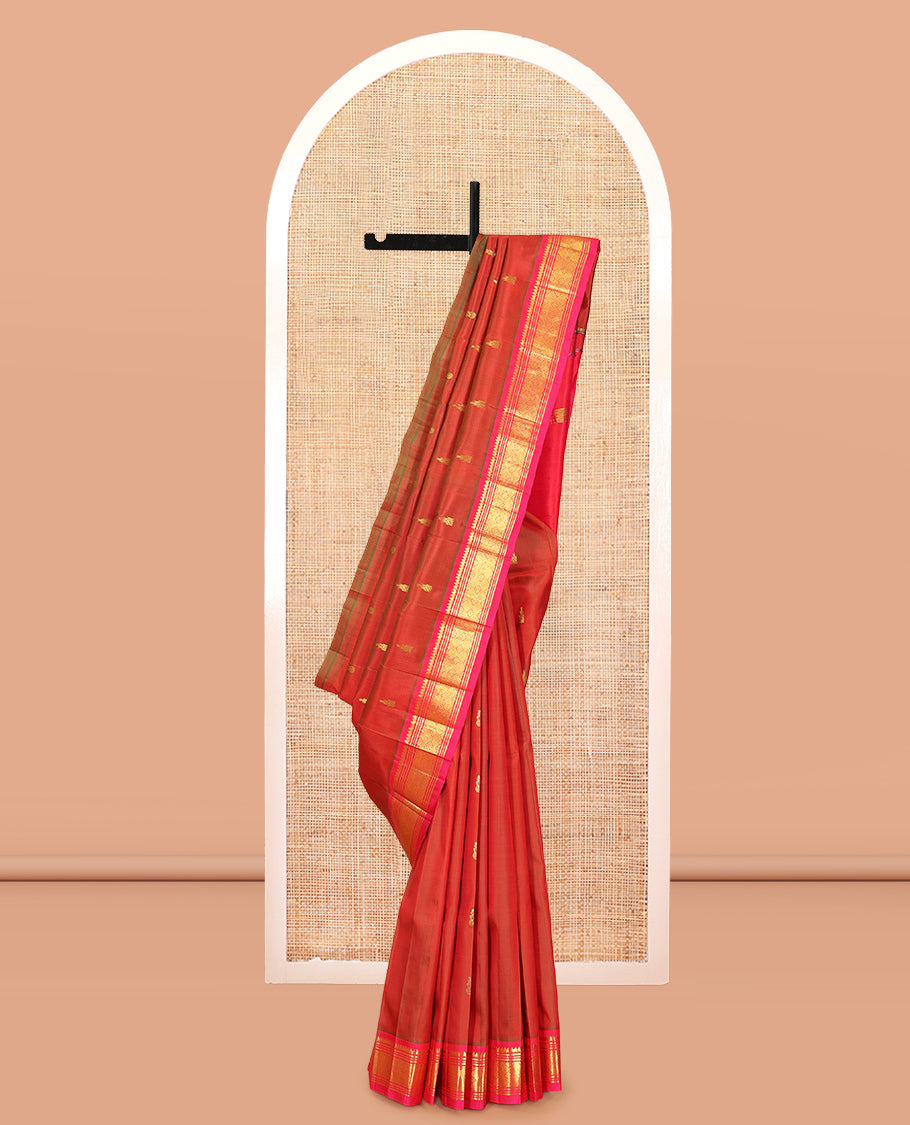 Rust Kanchipuram Silk Saree, Accentuated with Zari Buttas, Complemented by a Contrast Border of Thilakam Mokku, Banaras, Muthu, and Jaal Design, Pallu of Zari Design, and No Blouse