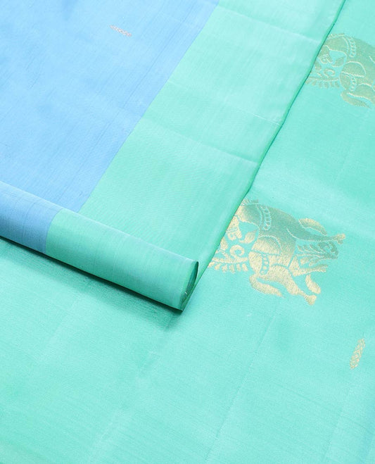 Blue buttas kancheepuram silk saree with contrast mayil design border & floral design pallu
