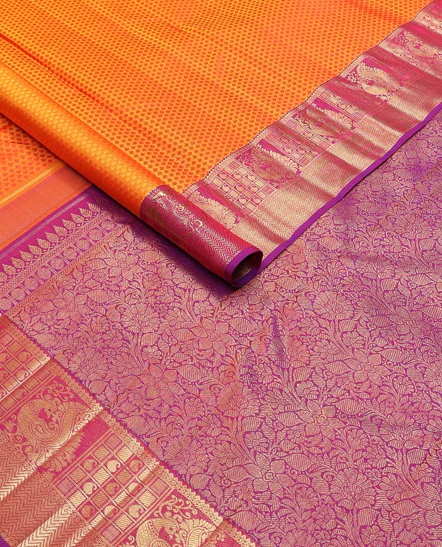 Orange floral design silk saree with contrast border of rekku, paun, mayil, manga, vanki design & floral design pallu