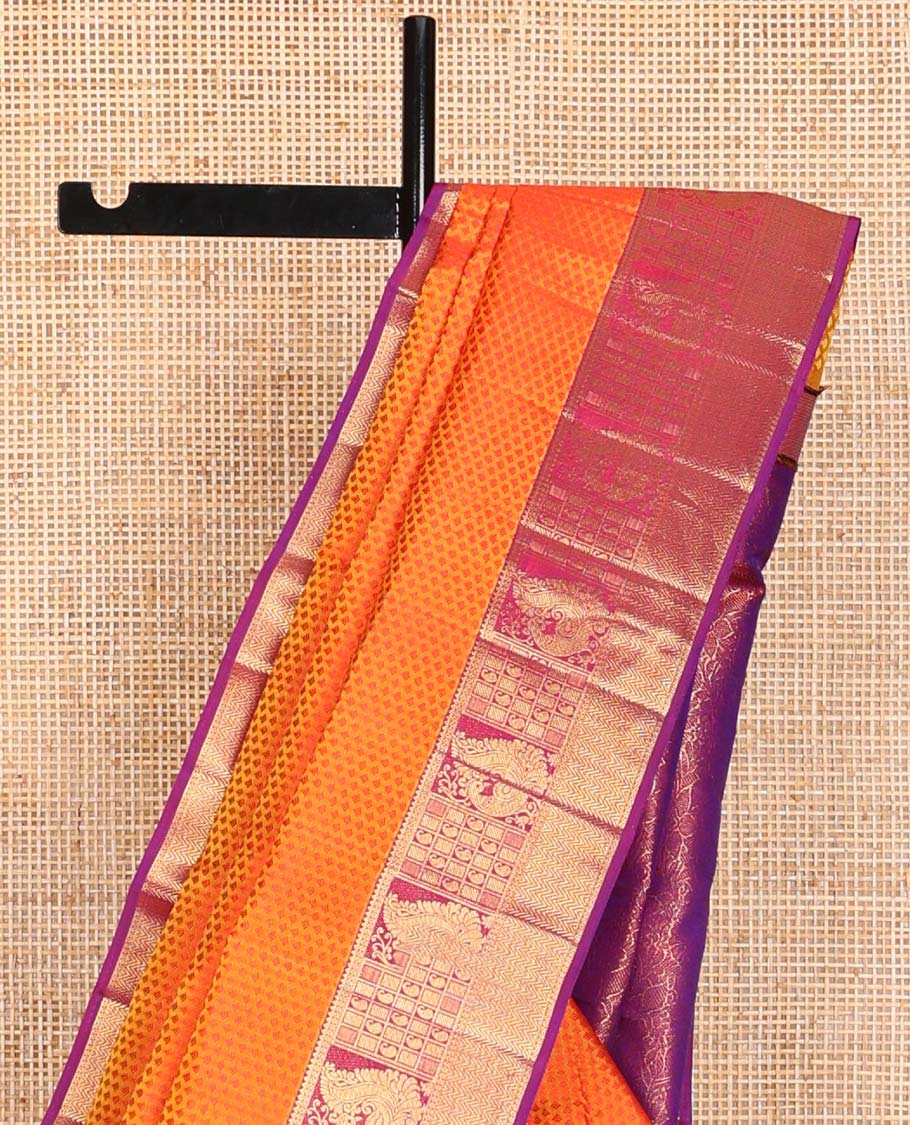 Orange floral design silk saree with contrast border of rekku, paun, mayil, manga, vanki design & floral design pallu