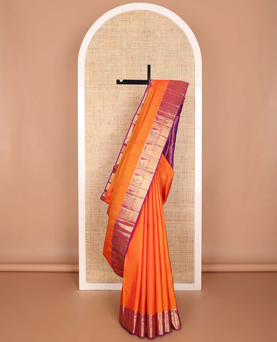 Orange floral design silk saree with contrast border of rekku, paun, mayil, manga, vanki design & floral design pallu