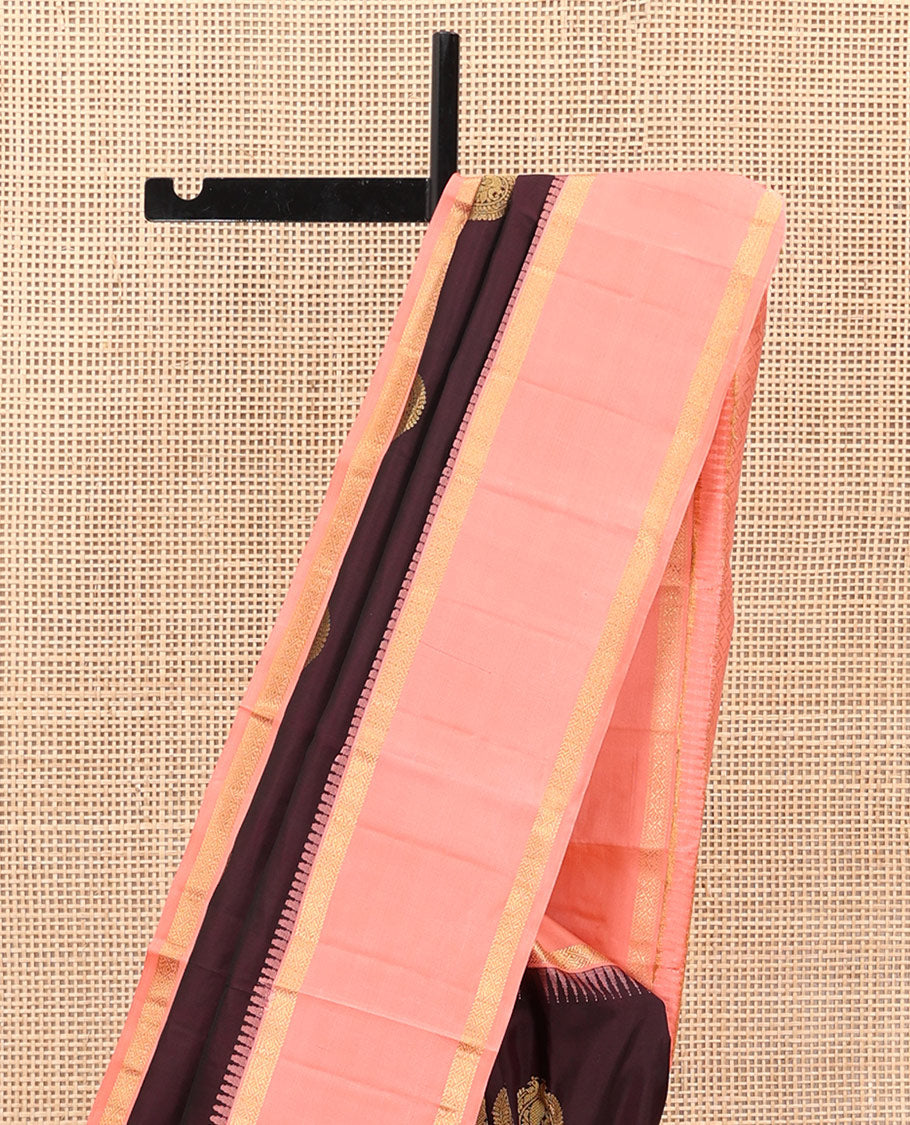 Coffee Brown Vasundhara Silk Saree Accentuated with Round Mayil Buttas, Complemented with Contrast Rettai Pettu Thazampoo Rekku Zari Border, Beautifully Woven Pallu of Jaal Design, and Paired with a Contrast Blouse