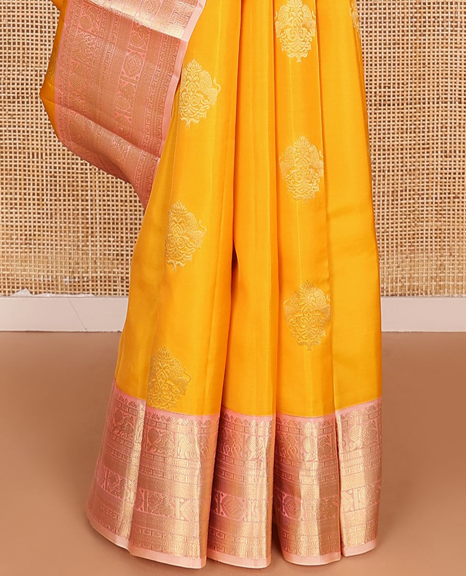 Yellow Vasundhara Lite Silk Mix Saree Ornamented with Singam Buttas, Complemented by a Contrast Border Featuring Yaanai, Mayil, Chakram, and Manga Designs, Intricately Zari Decked Up Pallu, and a Contrast Blouse