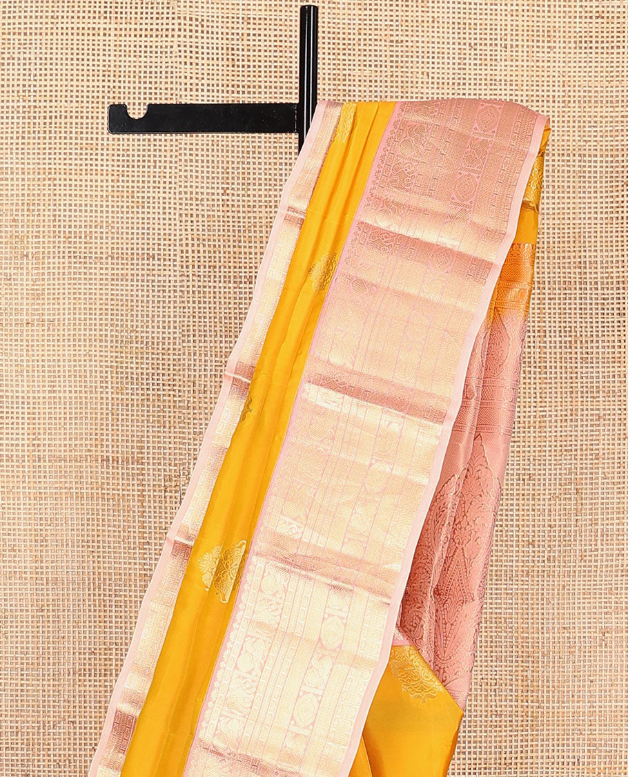 Yellow Vasundhara Lite Silk Mix Saree Ornamented with Singam Buttas, Complemented by a Contrast Border Featuring Yaanai, Mayil, Chakram, and Manga Designs, Intricately Zari Decked Up Pallu, and a Contrast Blouse