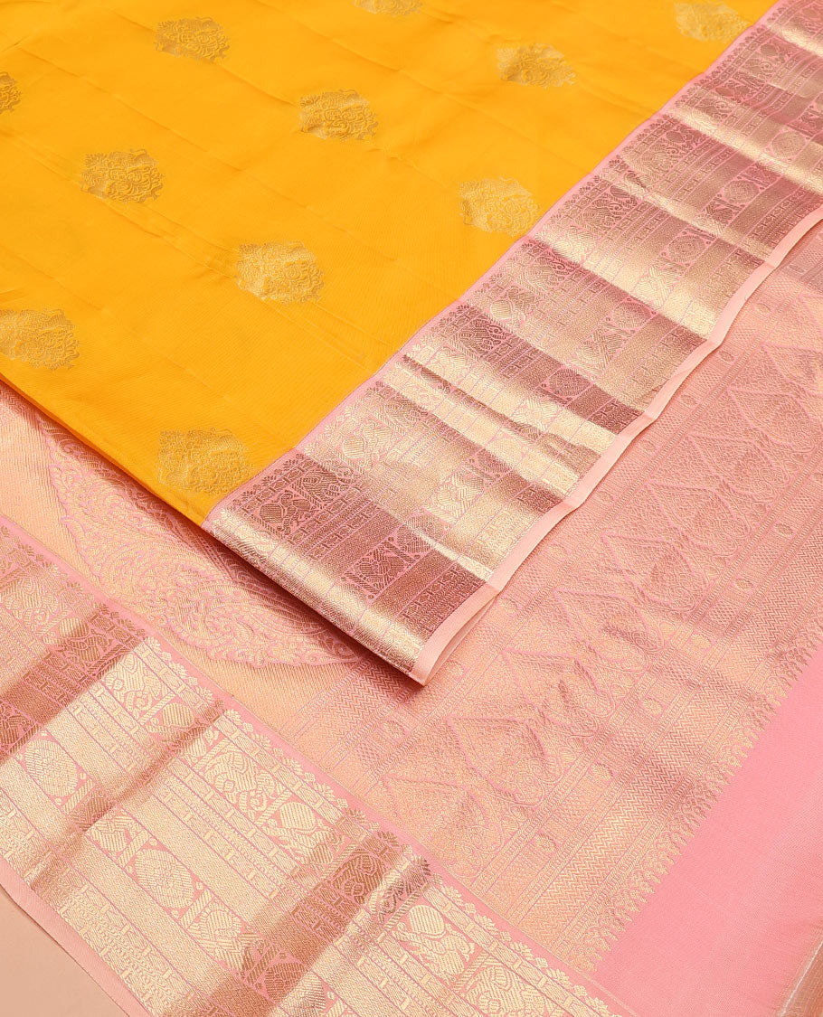Yellow Vasundhara Lite Silk Mix Saree Ornamented with Singam Buttas, Complemented by a Contrast Border Featuring Yaanai, Mayil, Chakram, and Manga Designs, Intricately Zari Decked Up Pallu, and a Contrast Blouse