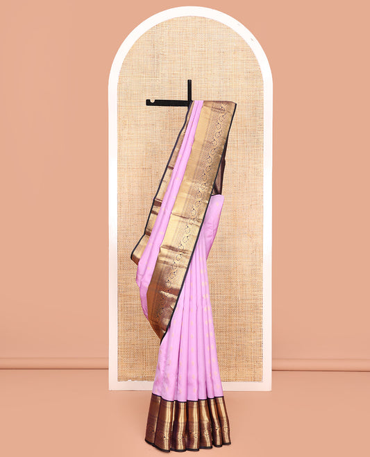 Lavender Vasundhara Lite Silk Mix Saree, Subtly Sparkled With Zari Buttas All Over Its Body, Complemented by Contrast Border of Salngai, Mayil Kann, Kamalam, and Dhavana Kodi Designs, Grand Jaal Pallu and Paired with a Contrast Blouse