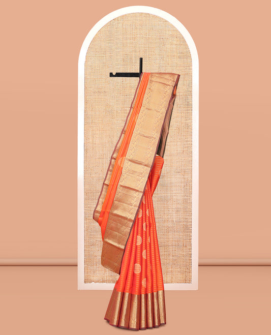 Orange Vasundhara Lite Silk Mix Saree, Bedecked with Zari Buttas and Stripes, a Contrast Border of Kodi Visiry, Mayil, and Mayil Kann Designs, Jaal Pallu, and a Contrast Blouse