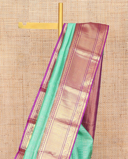 Sea Green Vasundhara Silk Saree Sparsely Sparkled with Polka dot and Checks All Over Its Body, Complemented by a Contrast Border of Manga, Kathir, Kodi Visiry, and Kuyil Designs, Zari Woven Pallu, and Paired with a Contrast Blouse