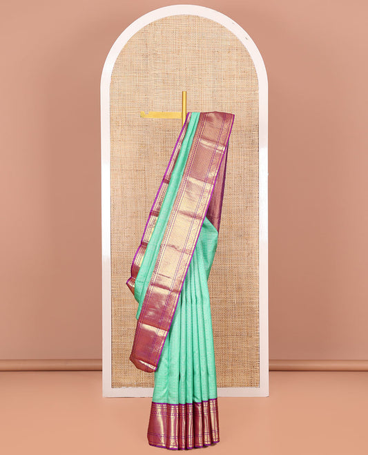Sea Green Vasundhara Silk Saree Sparsely Sparkled with Polka dot and Checks All Over Its Body, Complemented by a Contrast Border of Manga, Kathir, Kodi Visiry, and Kuyil Designs, Zari Woven Pallu, and Paired with a Contrast Blouse