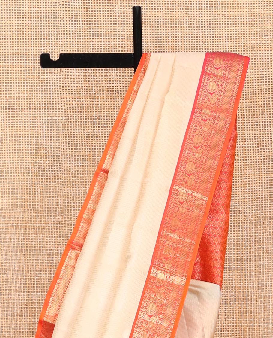 Sandal Vasundhara Silk Saree, Sparsely Woven with Zari Buttas on Its Body, Complemented by Contrast Border of Rudraksham, Mayil, Chakram, Muthu, and Mayil Kann Designs, Grandly Decked Up Pallu, and Paired with a Contrast Blouse
