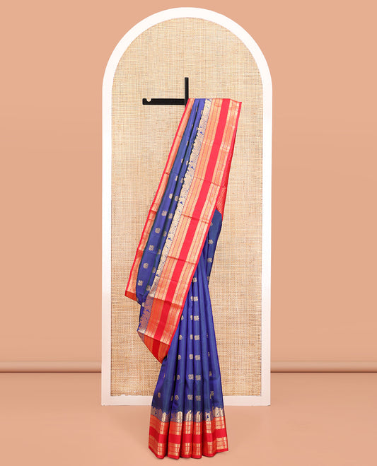 Blue Vasundhara Silk Saree, Dazzled with Mayil and Yaanai Buttas All Over Its Body, Complemented by Contrast Border of Wedding-Theme Motifs, Ara Bogudi, Muthu, and Ara Maadam Designs, Grand Jaal Pallu, and Paired with a Contrast Blouse