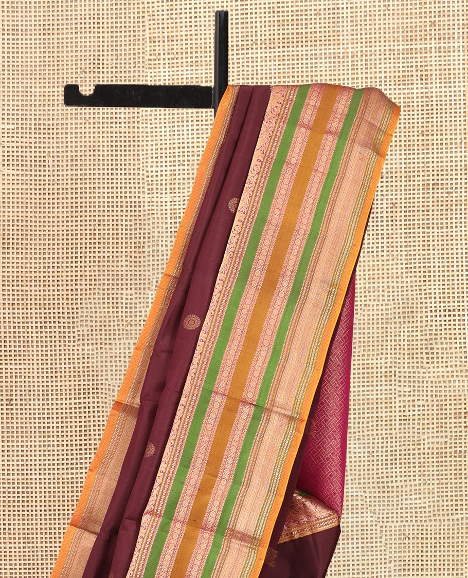 Brown Vasundhara Silk Saree, Delicately Woven with Mayil-Chakram Buttas, a Contrast Border of Kathir, Mayil, Yaanai, Muthu, Neli, and Laddu Kamalam Designs, a Grand Pallu, and a Contrast Blouse