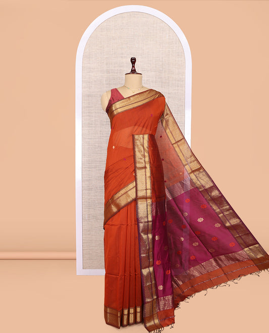 Orange Maheshwari Cotton Saree, Adorned with Buttas, Complemented by a Contrast Traditional Zari Border, Pallu Gleamed Up with Zari Buttas, and a Contrast Blouse