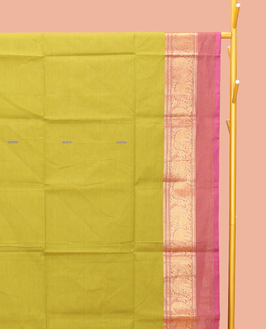 Parrot Green Chettinad Cotton Saree, Woven with Buttas All Over Its Body, Complemented by a Contrast Ganga-Jamuna Kal Eragina Border of Kodi Peacock and Elephant Designs, Pallu of Buttas and Stripes, and Paired with a Matching Blouse