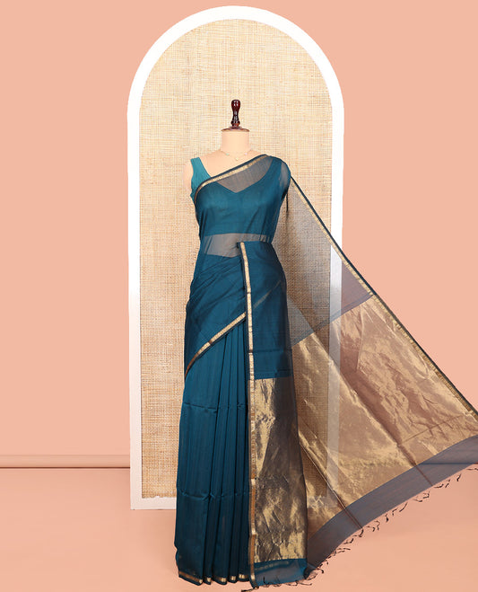Peacock Blue Maheshwari Cotton Saree, Subtly Sparkled with Zari Buttas All Over Its Body, Highlighted by Zari Pipping Border, Scintillating Zari Decked Up Pallu and Paired with a Matching Blouse