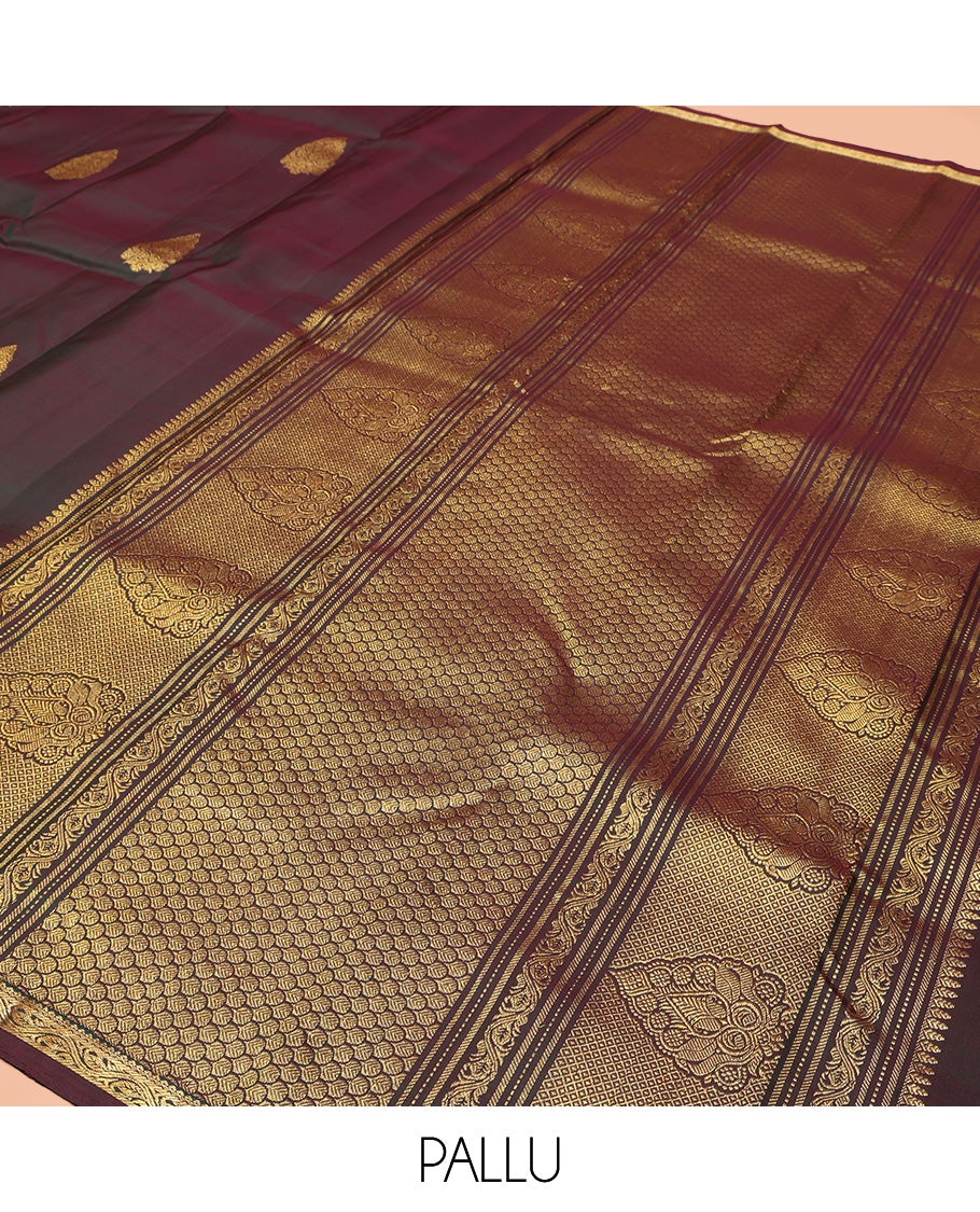 Brown Kanchipuram Silk Saree, Elevated with Zari Buttas All Over Its Body, Highlighted by Zari Piping Border, Grand Scallop Design Pallu, and Paired with a Matching Blouse