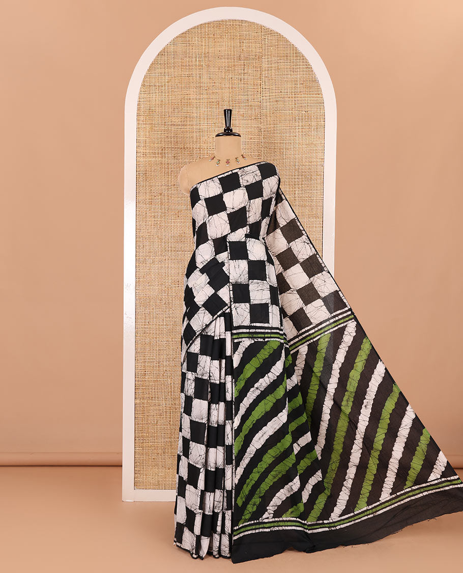 Borderless black green chess theme batik printed mul cotton saree with contrast leheriya striped pallu, and a contrast batik printed blouse