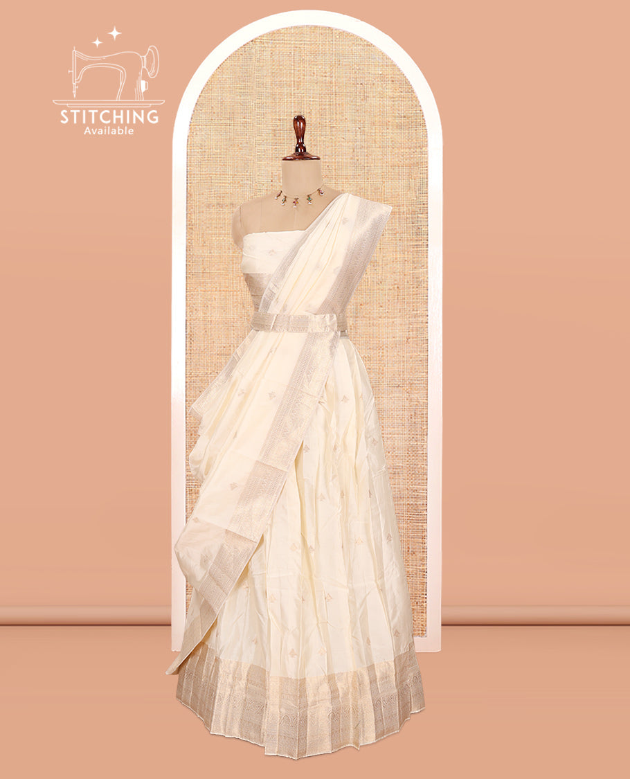 Cream Semi-Banarasi Half Saree, Zari Buttas Top, a Matching Blouse, and Intricately Designed Dhavani