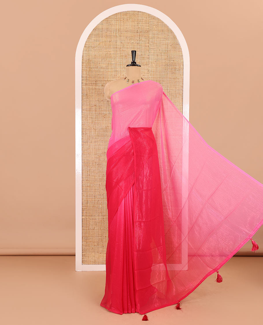 Borderless pink ombre-toned gleaming Shimmer Georgette saree, self-pallu with tassels and a plain pink blouse