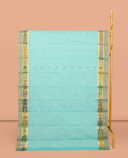 Turquoise Kanchi Cotton Saree, Showcasing Buttas All Over Its Body, Complemented by a Contrast Ikkat Border, Pallu of Floral Design, and Paired with a Matching Blouse