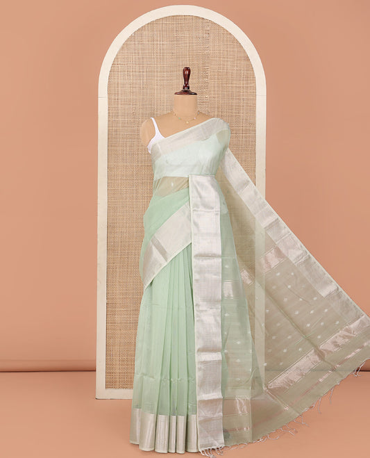 Green Maheshwari Cotton Saree, Sparsely Sparkled with Buttas All Over Its Body, Highlighted by Zari Border of Chevron Designs, Pallu Steeped with Buttas, and Paired with a Matching Blouse