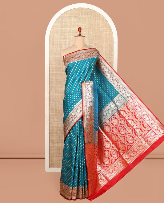Blue Semi-Banaras Saree, Boldly Accentuated with Buttas on Its Body, Complemented by a Contrast Floral Creeper Design Border, Intricately Designed Pallu, and Paired with a Contrast Blouse
