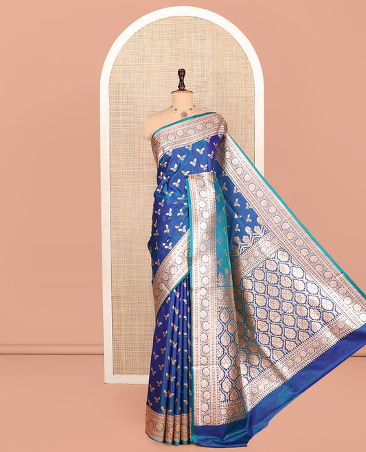 Blue Banarasi Nylon Saree, Bedecked with Floral Buttas, Highlighted by a Traditional Zari Border, Intricate Pallu, and a Matching Blouse