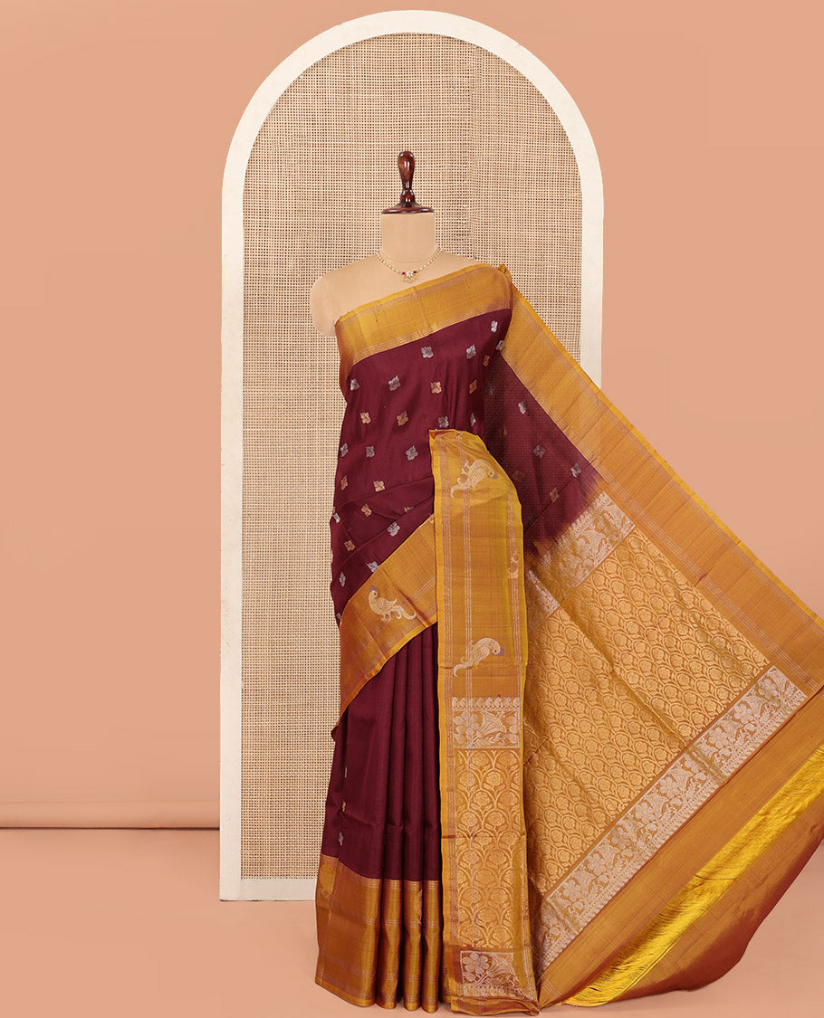 Maroon Uppada Silk Saree Ornamented with Zari Buttas, Complemented by a Contrast Zari Border of Bird Designs, Contrast Pallu of Scallop Designs, and Paired with a Contrast Blouse