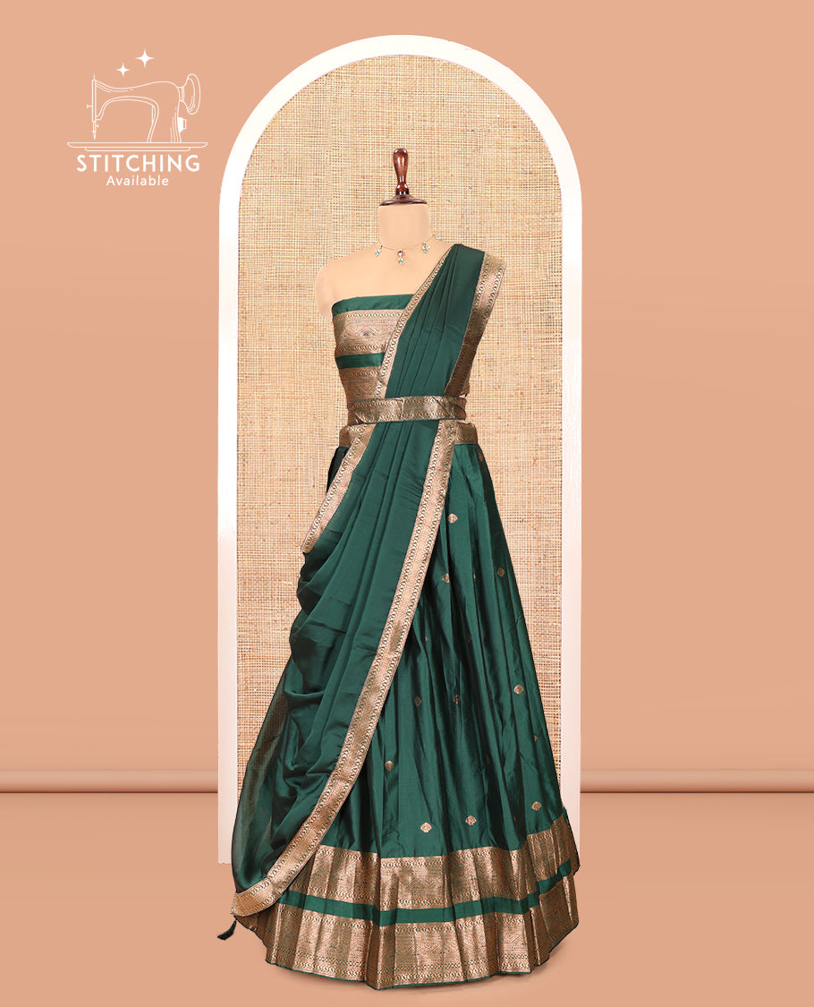 Green Semi-Silk Half-Saree, Adorned with Zari Buttas Woven Skirt, a Rettai Pettu Traditional Border, a Matching Blouse, and Dhavani